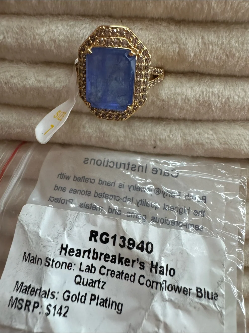 Heartbreaker’s Halo Gold Cocktail Ring with Deep Blue Center Stone